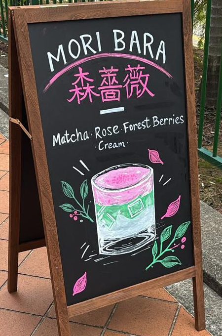 Hand-drawn chalkboard advertising Mori Bara, a matcha, rose, forest berry and cream drink
